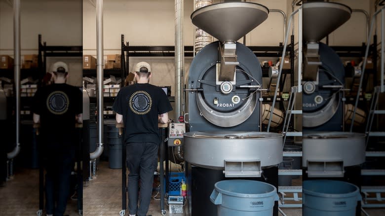 Worker roasting coffee beans at Madcap Coffee