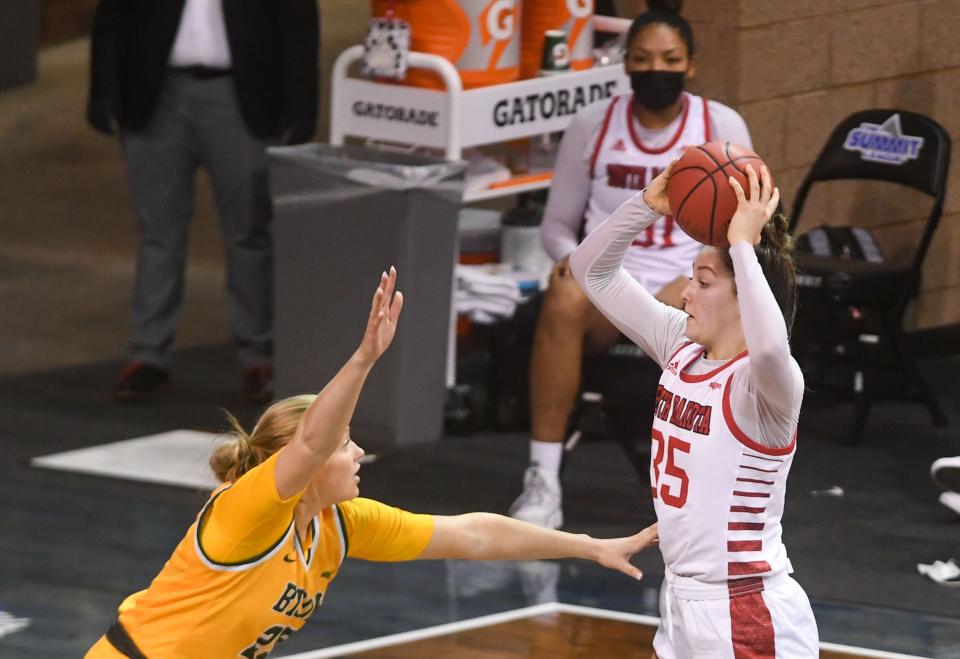 South Dakota's Allison Peplowski keeps the ball from North Dakota State's Britney Epperson during the Summit League Tournament on Monday, March 8, 2021, at the Sanford Pentagon in Sioux Falls.