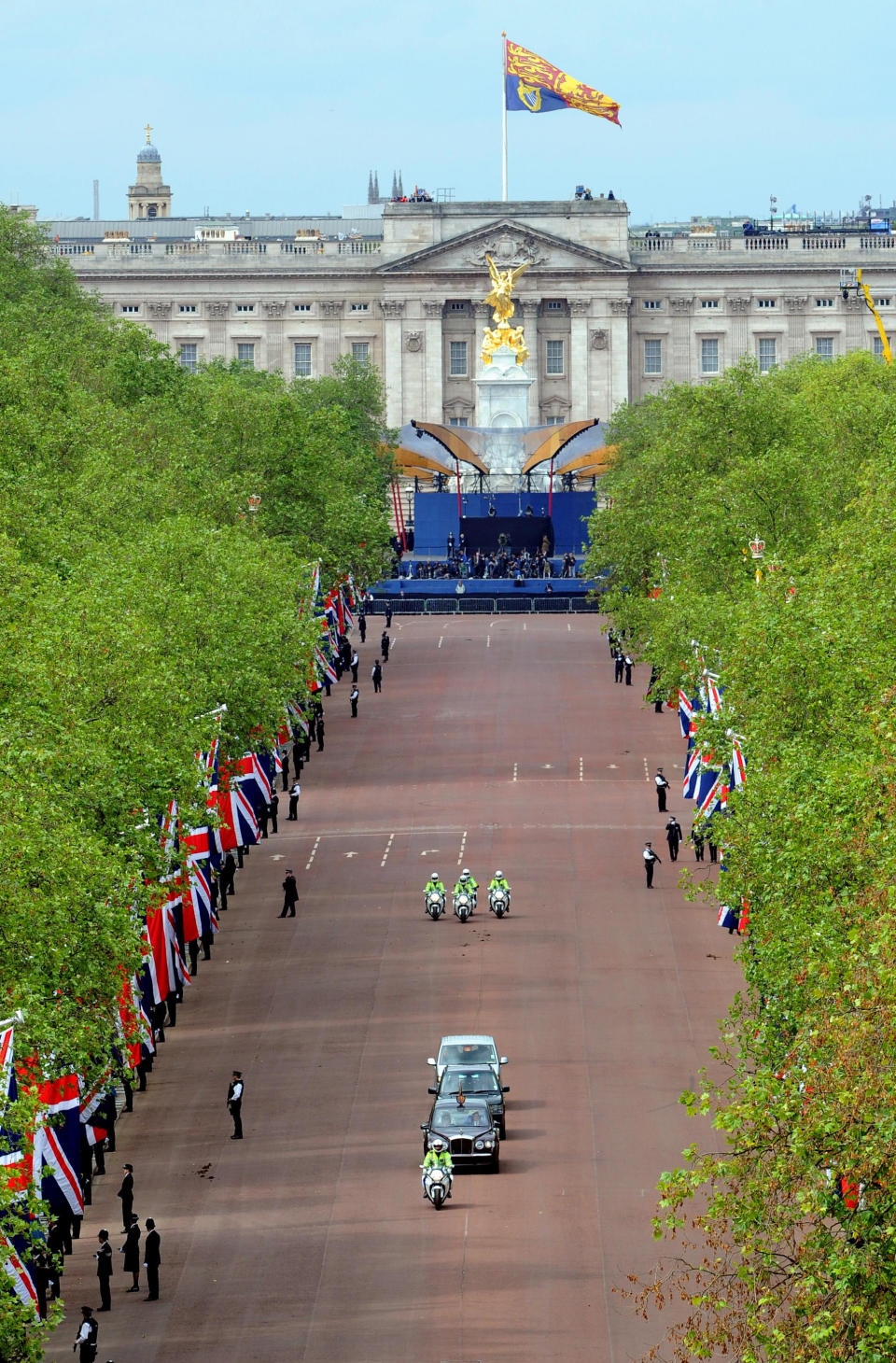 Queen Elizabeth II is driven down the Mall, London, for a service of thanksgiving at St Paul's Cathedral as the Diamond Jubilee celebrations continue. Tuesday June 5, 2012. Buckingham Palace is in the background. (AP Photo/Anthony Devlin/Pool)