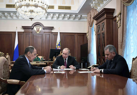 Russian President Vladimir Putin meets with Defence Minister Sergei Shoigu and Foreign Minister Sergei Lavrov at the Kremlin in Moscow, Russia, February 2, 2019. Sputnik/Alexei Nikolsky/Kremlin via REUTERS