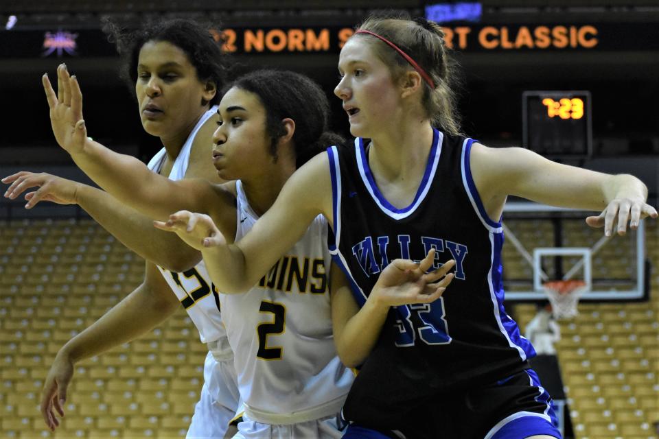 Rock Bridge's Malia Chievous (2) and Jayda Porter (far left) double team Grain Valley's Grace Slaughter (33) during the 2022 Norm Stewart Classic on Dec. 16, 2022, at Mizzou Arena in Columbia, Mo.