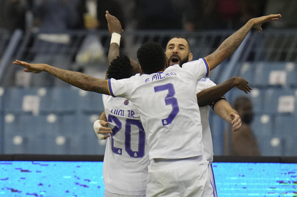 Real Madrid's players celebrate after a goal during the Spanish Super Cup final soccer match between Real Madrid and Athletic Bilbao at King Fahd stadium in Riyadh, Saudi Arabia, Sunday, Jan. 16, 2022. (AP Photo/Hassan Ammar)