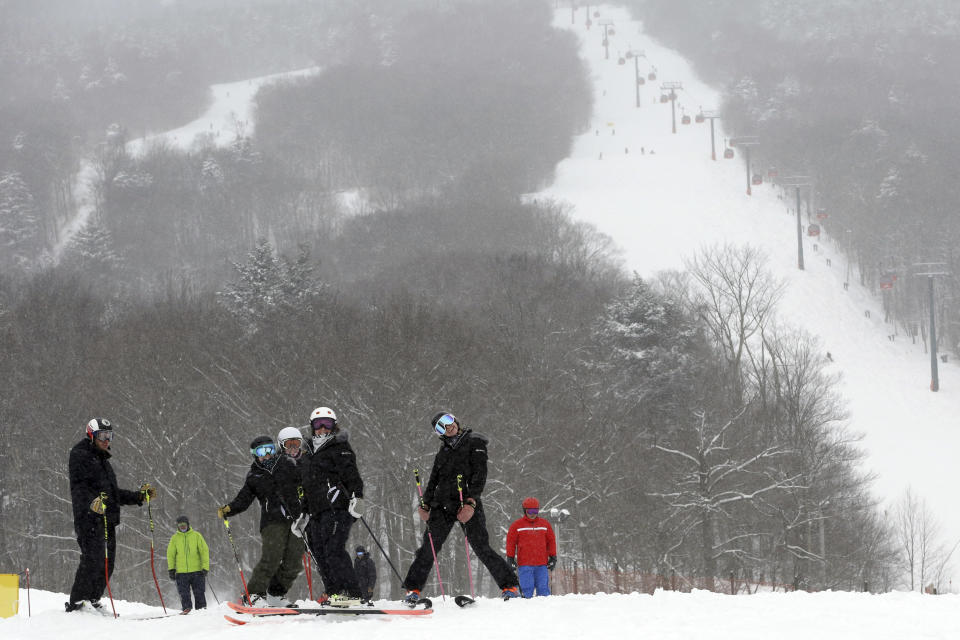 Skiers take to the slopes at the Stowe ski resort in Stowe, Vt., Friday, Feb. 4, 2022. While much of the northern United States was digging out from a winter storm, skiers were thrilled with the added snow. (AP Photo/Wilson Ring)