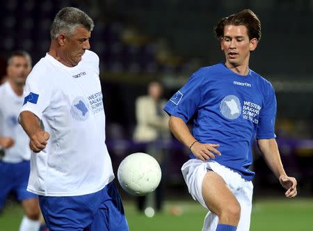 Kosovo's Foreign Minister Hashim Thaci (L) and Austria's Foreign Minister Sebastian Kurz fight for the ball during a politicians' soccer match ahead of the Western Balkans Summit in Vienna, Austria, August 26, 2015. REUTERS/Heinz-Peter Bader