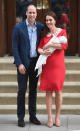 <p> As with her two previous birth debuts, Kate wore Jenny Packham for the unveiling of her third child, Prince Louis. The red color of the dress hearkened back to Princess Diana's red coat that she was wearing when she debuted Prince Harry (it even included a white peter pan color, similar to the construction on Kate's dress). William kept it simple in a light blue collared shirt, blue blazer, and black pants. Kate opted for suede shoes to go with the dress. </p>