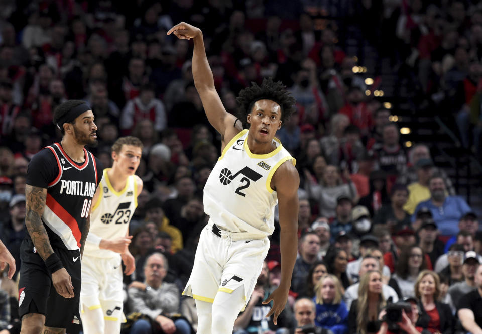 Utah Jazz guard Collin Sexton, right, reacts after hitting a shot as Portland Trail Blazers guard Gary Payton II, left, looks on during the first half of an NBA basketball game in Portland, Ore., Wednesday, Jan. 25, 2023. (AP Photo/Steve Dykes)