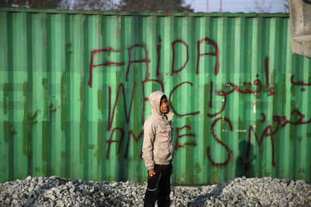 A child stands at a makeshift camp for migrants and refugees at the Greek-Macedonian border near the village of Idomeni, Greece, April 6, 2016. REUTERS/Marko Djurica