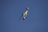 A French Army Eurocopter Tiger helicopter performs during the inauguration the 53rd International Paris Air Show at Le Bourget Airport near Paris, France, Monday June 17, 2019. The world's aviation elite are gathering at the Paris Air Show with safety concerns on many minds after two crashes of the popular Boeing 737 Max. (Benoit Tessier/Pool via AP)