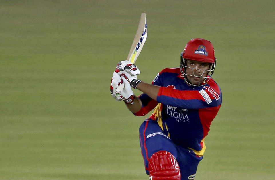 Karachi Kings' Sharjeel Khan follows the ball after playing a shot for six during a Pakistan Super League T20 cricket match between Karachi Kings and Islamabad United at the National Stadium, in Karachi, Pakistan, Wednesday, Feb. 24, 2021. (AP Photo/Fareed Khan)