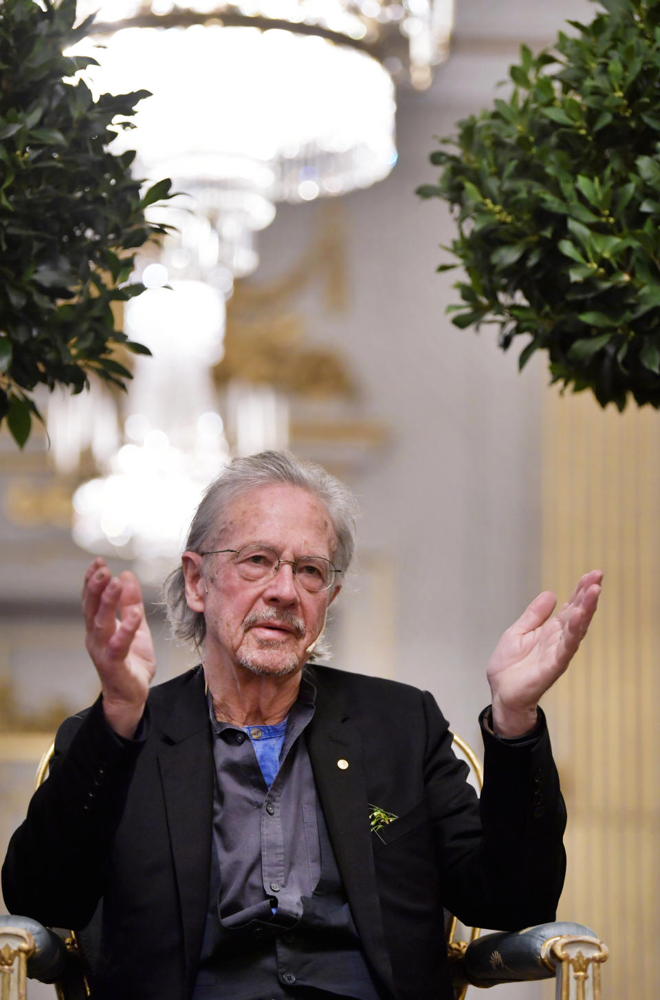 2019 Nobel Prize laureate in literature Peter Handke speaks at a press conference at the Swedish Academy in Stockholm, Sweden, Monday Dec. 6, 2019. (Anders Wiklund/TT via AP)