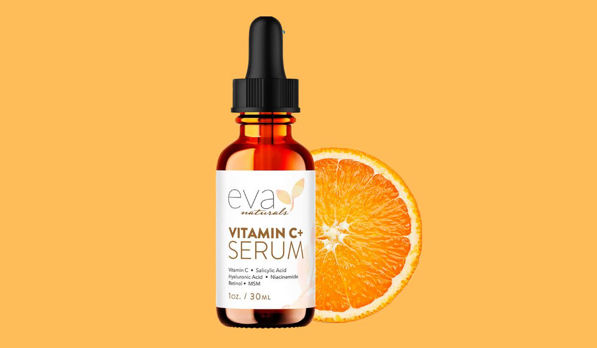 vitamin C serum next to an orange