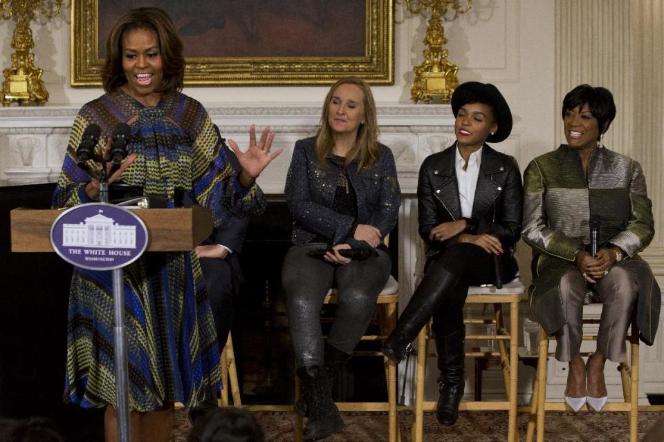 First lady Michelle Obama speaks in the State Dining Room of the White House in Washington, Thursday, March 6, 2014, with singers, from second from left, Melissa Etheridge, Janelle Monáe, and Patti LaBelle, during a workshop for students as part of the “In Performance at the White House” series, celebrating female artists as the "foremothers” of American music. (AP Photo/Jacquelyn Martin)