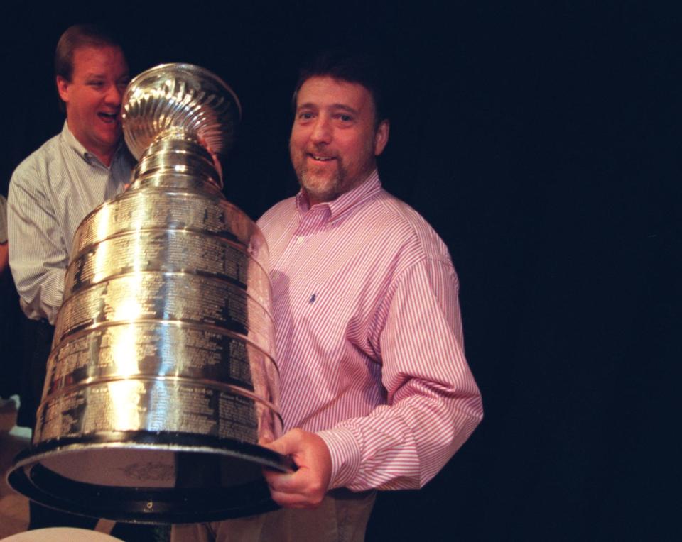 Bill Roose, left, and Mick McCabe hold the Stanley Cup at Allen Park Cabrini High School on Tuesday, Aug. 26, 1997.