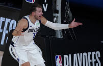 Dallas Mavericks' Luka Doncic (77) pleads with a referee during the second half of an NBA first round playoff game against the Los Angeles Clippers Sunday, Aug. 30, 2020, in Lake Buena Vista, Fla. (AP Photo/Ashley Landis)