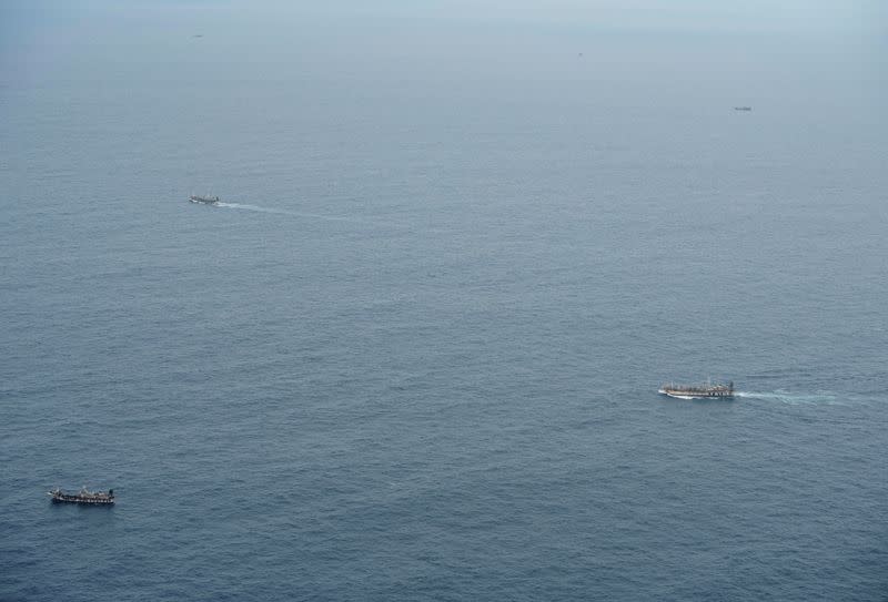 Fishing boats are seen from an aircraft of the Ecuadorian navy after a fishing fleet of mostly Chinese-flagged ships was detected in an international corridor that borders the Galapagos Islands' exclusive economic zone, in the Pacific Ocean