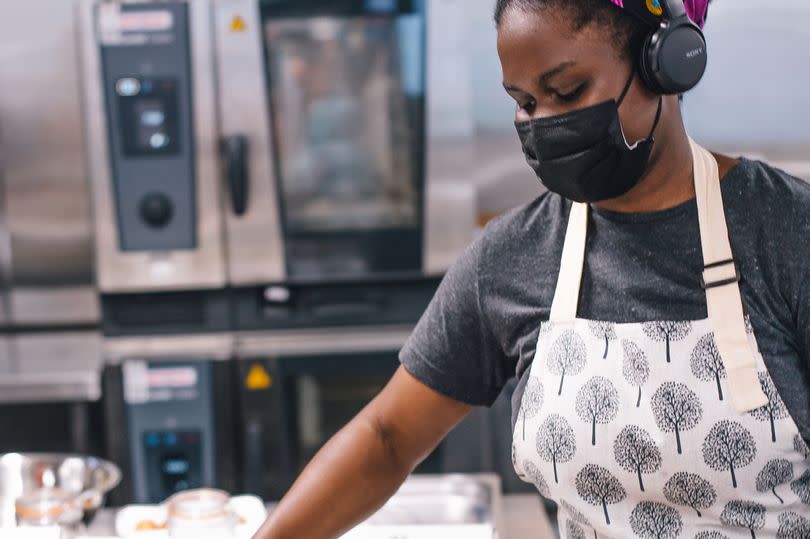 Fola making puff puffs in the kitchen