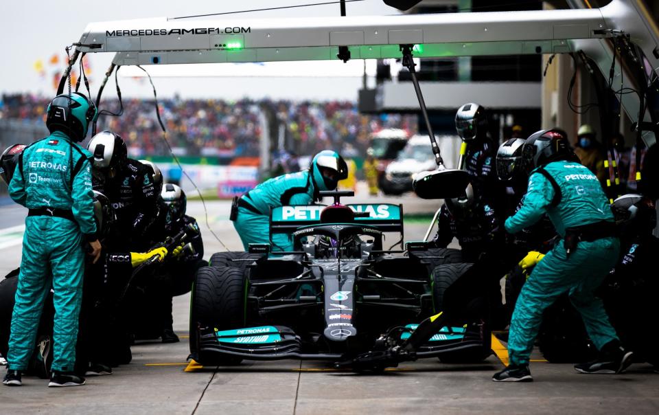 Lewis Hamilton of Great Britain driving the (44) Mercedes AMG Petronas F1 Team Mercedes W12 makes a pitstop during the F1 Grand Prix of Turkey at Intercity Istanbul Park on October 10, 2021 in Istanbul, Turkey - Getty Images Sport 
