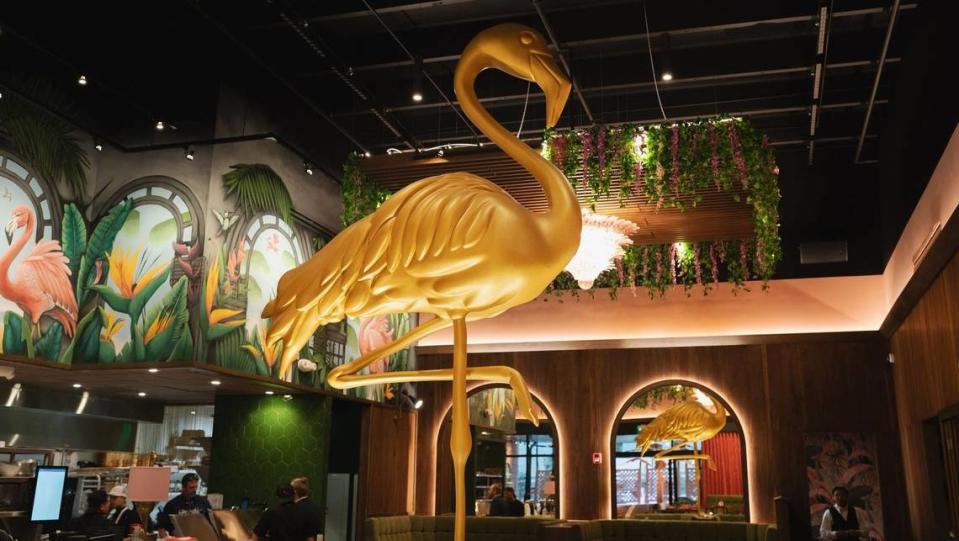 A gold flamingo statue sets the ambiance at Pink Steak in Palm Beach.