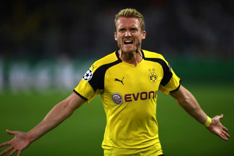 Dortmund's midfielder Andre Schuerrle reacts after scoring during the UEFA Champions League first leg football match between Borussia Dortmund and Real Madrid on September 27, 2016