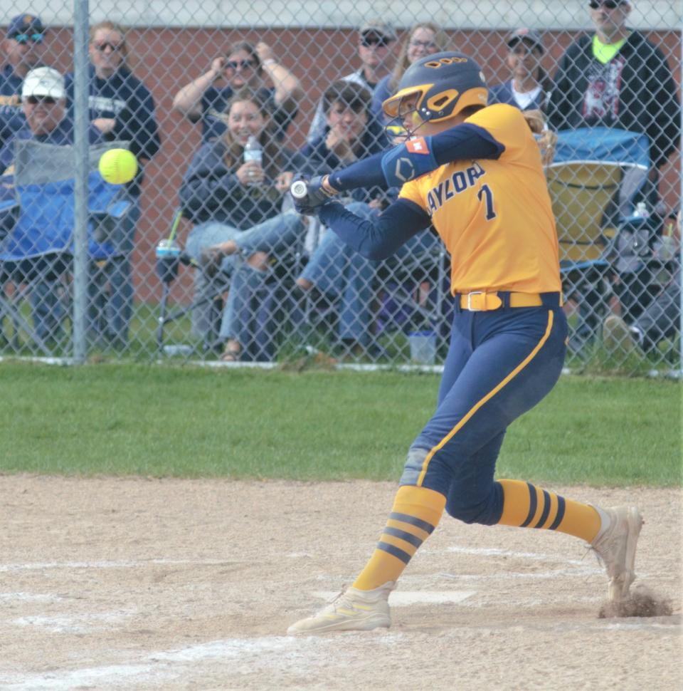 Aubrey Jones connects with a pitch during a high school softball matchup between Gaylord and Traverse City Central on Tuesday, May 16.