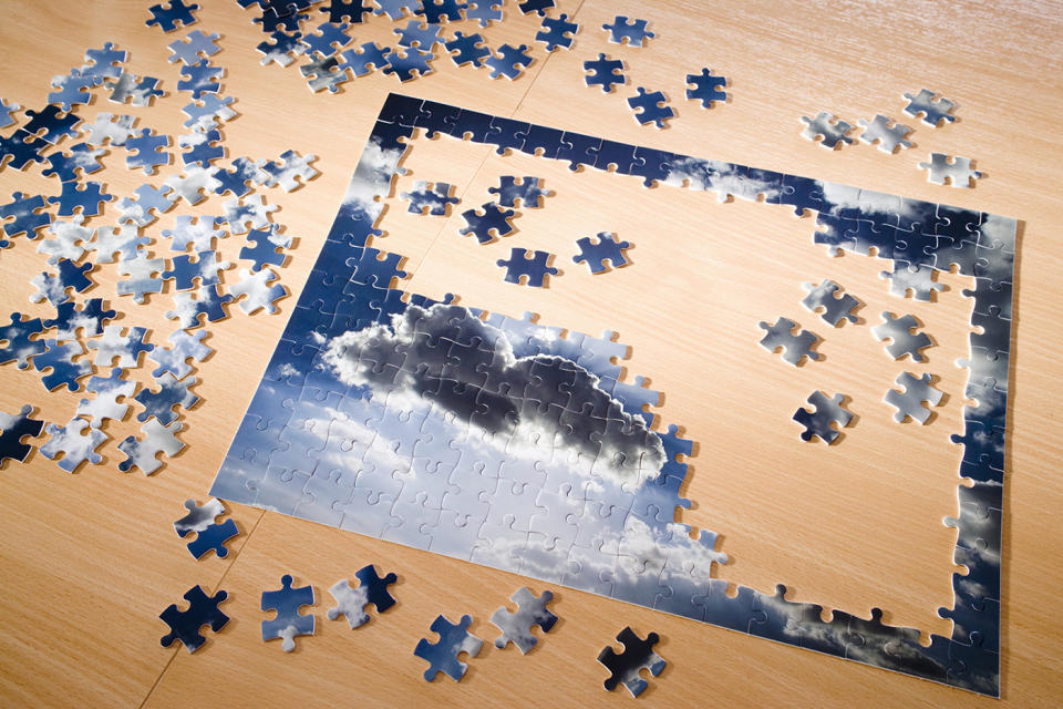 Completing puzzles, exercising and reading can help alleviate feelings of isolation and boredom during quarantine. (Image via Getty Images)