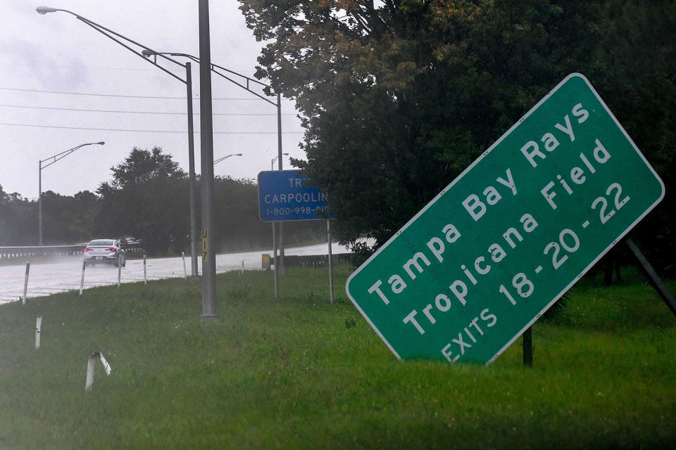 <p>A sign for the Tampa Bay Rays' Tropicana Field is toppled on Sept. 28.</p>