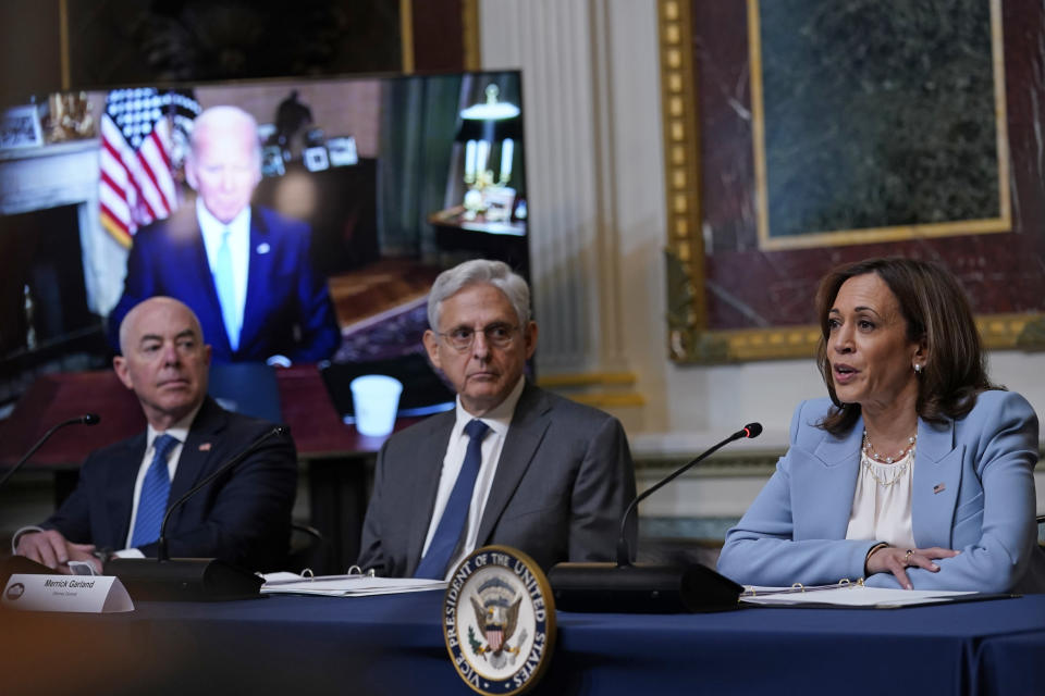 Vice President Kamala Harris, right, speaks in the Indian Treaty Room on the White House complex in Washington, Wednesday, Aug. 3, 2022, on securing access to reproductive and other health during the first meeting of the interagency Task Force on Reproductive Healthcare Access. President Joe Biden attends virtually and Homeland Security Secretary Alejandro Mayorkas, left, and Attorney General Merrick Garland, center, attend in person. (AP Photo/Susan Walsh)