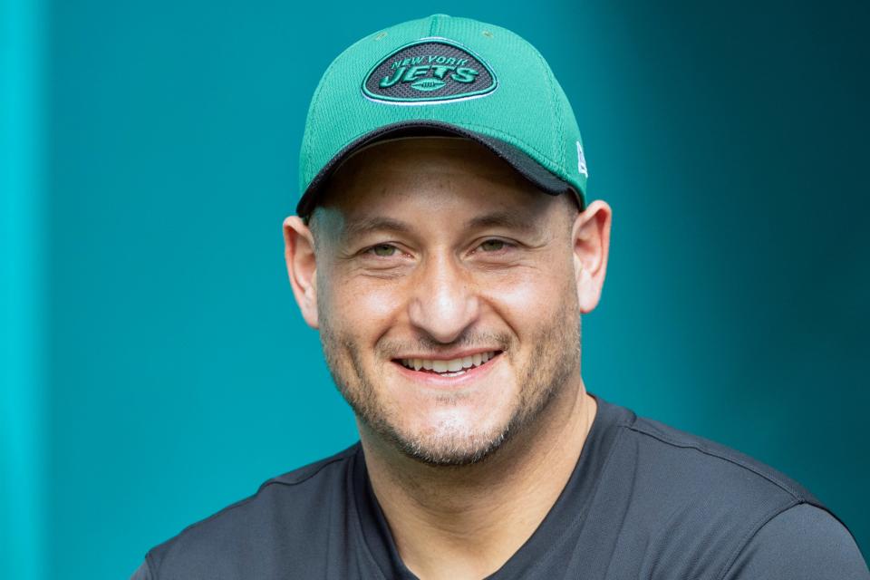 FILE -New York Jets special teams assistant Michael Ghobrial smiles as he walks on to the field before an NFL football game against the Miami Dolphins, Sunday, Dec. 19, 2021, in Miami Gardens, Fla. The New York Giants have dipped into the rival Jets' coaching staff and hired Michael Ghobrial to be their special teams coordinator Thursday, Jan. 25, 2024.(AP Photo/Doug Murray, File)