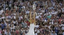 Jelena Jankovic of Serbia celebrates after winning her match against Petra Kvitova of the Czech Republic at the Wimbledon Tennis Championships in London, July 4, 2015. REUTERS/Henry Browne