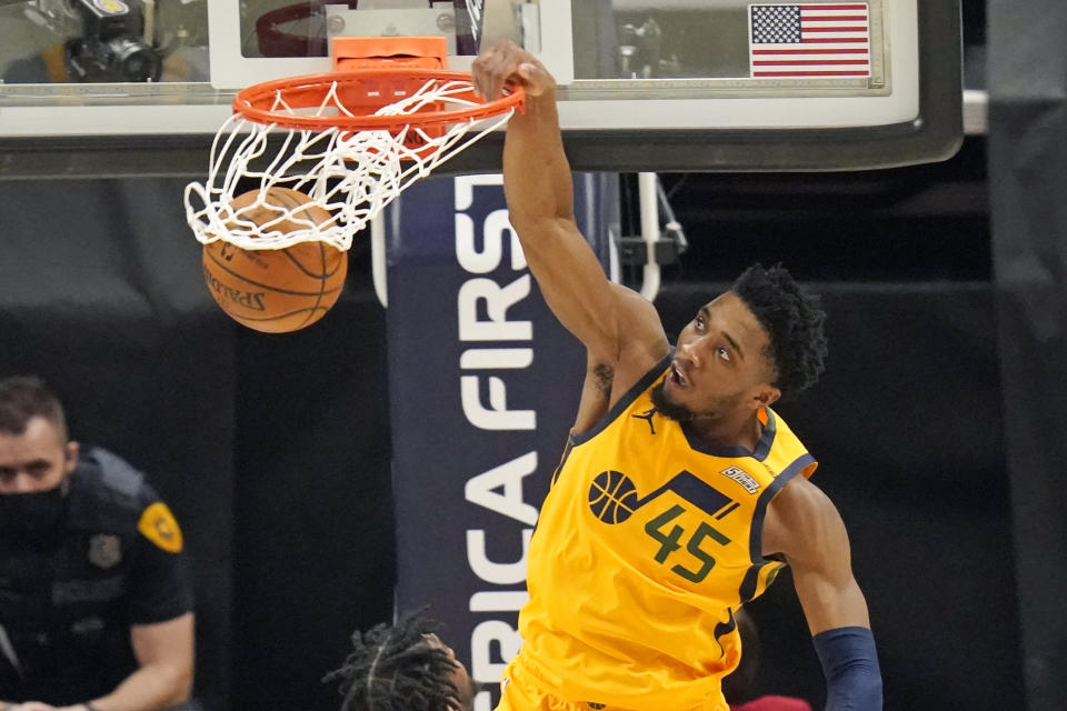 Utah Jazz guard Donovan Mitchell (45) dunks against the Charlotte Hornets in the second half during an NBA basketball game Monday, Feb. 22, 2021, in Salt Lake City. (AP Photo/Rick Bowmer)