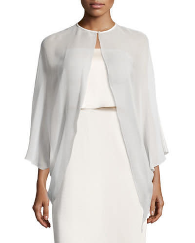 Buy the <a href="http://www.bergdorfgoodman.com/Halston-Heritage-Cape-Sleeve-Silk-Georgette-Coverup/prod126640029/p.prod?ecid=BGCS__GooglePLA&amp;utm_medium=CSE&amp;utm_source=BGCS__GooglePLA&amp;utm_campaign=HalstonHeritage" target="_blank">Halston Heritage cape-sleeve silk georgette coverup</a>&nbsp;for $165