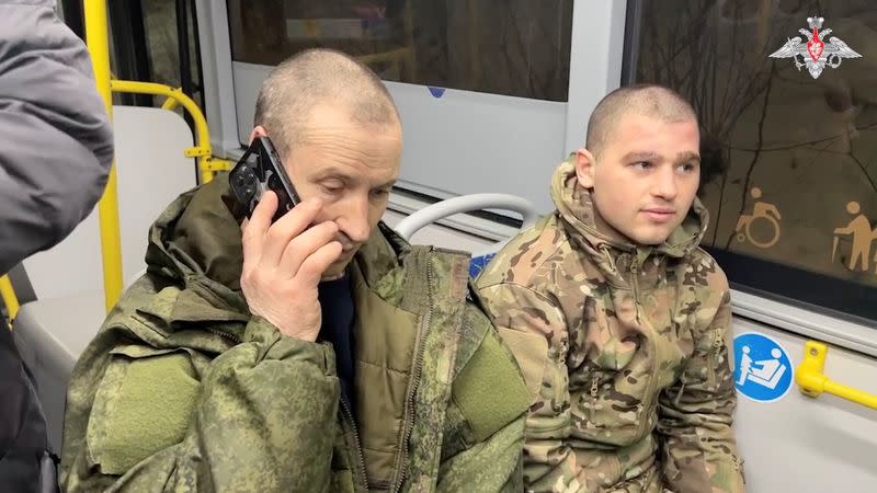 A still image from video, released by the Russian Defence Ministry, shows what it said to be captured Russian service personnel in a bus following the latest exchange of prisoners of war