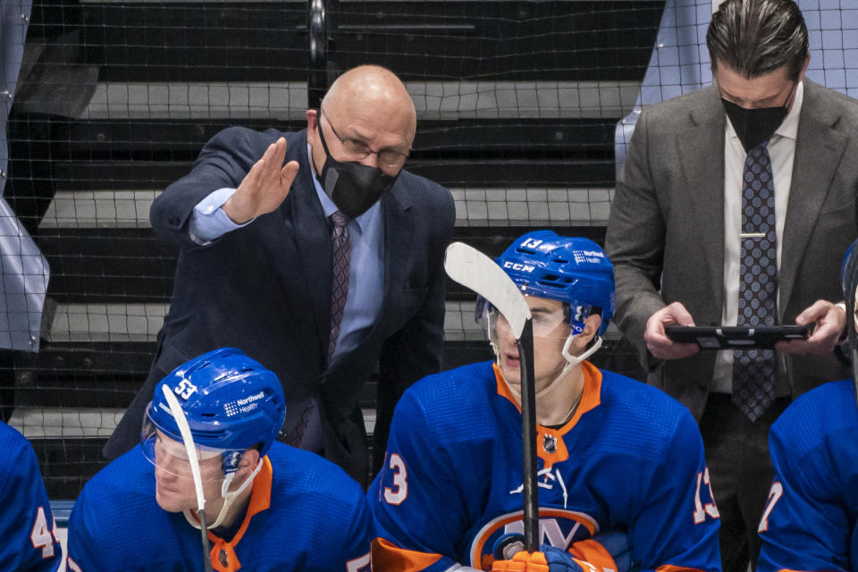 FILE - In this Saturday, April 3, 2021, file photo, New York Islanders coach Barry Trotz speaks to his players during the third period of an NHL hockey game against the Philadelphia Flyers at Nassau Coliseum in Uniondale, N.Y. The Penguins and Islanders meet in Game 1 of their opening-round series on Sunday. The Islanders swept Pittsburgh in the first round of the playoffs in 2019. (AP Photo/Corey Sipkin, File)