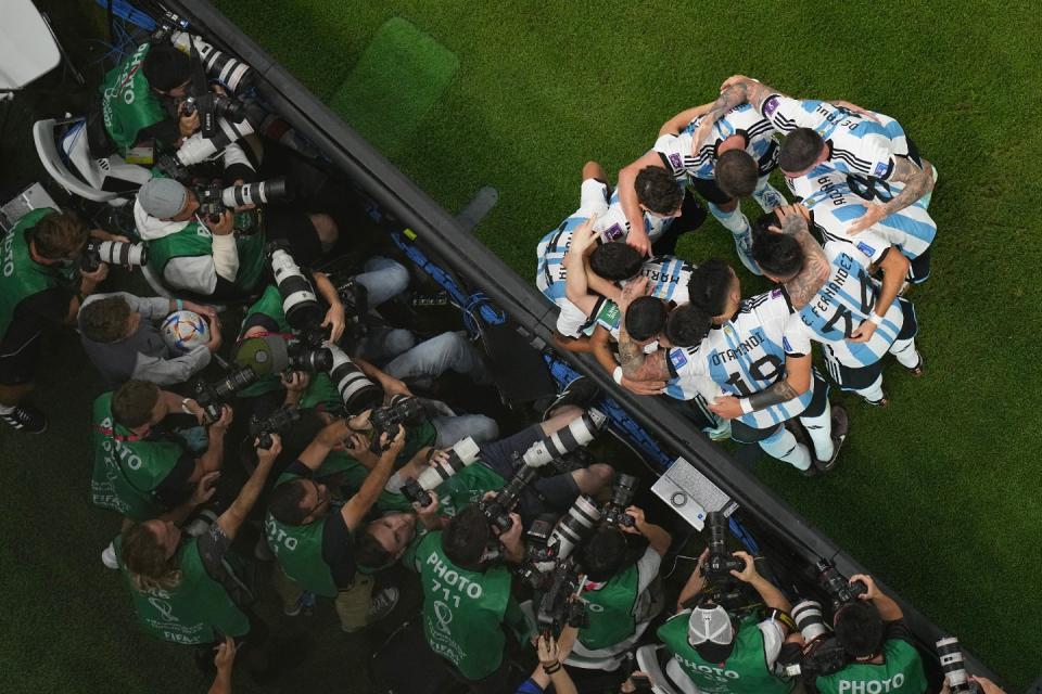 Argentina players celebrate Argentina's Lionel Messi's opening goal during the World Cup group C football match between Argentina and Mexico, at the Lusail Stadium in Lusail, Qatar, Saturday, Nov. 26, 2022. (AP Photo/Pavel Golovkin)