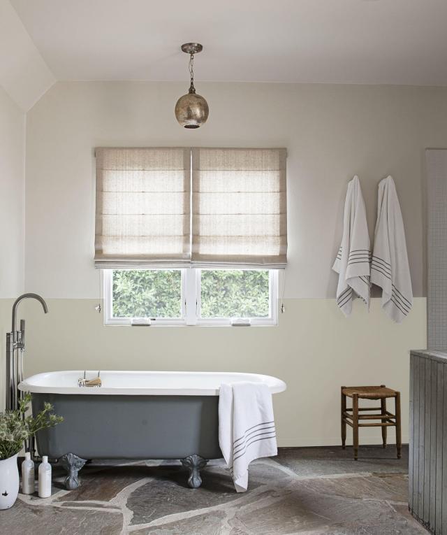 Bathroom Interior with Candles and a ClawFooted Tub · Creative Fabrica