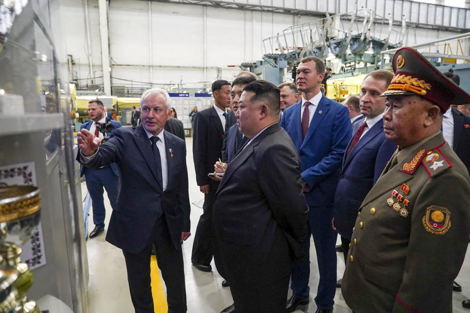 ADDS DATE - In this photo released by the governor of the Russian far eastern region of Khabarovsky Krai region Mikhail Degtyarev telegram channel, North Korean leader Kim Jong Un, center, listens to an explanation as he visits a Russian aircraft plant that builds fighter jets in Komsomolsk-on-Amur, about 6,200 kilometers (3,900 miles) east of Moscow, Russia Friday, Sept. 15, 2023. (The governor of the Russian far eastern region of Khabarovsky Krai region Mikhail Degtyarev telegram channel via AP)