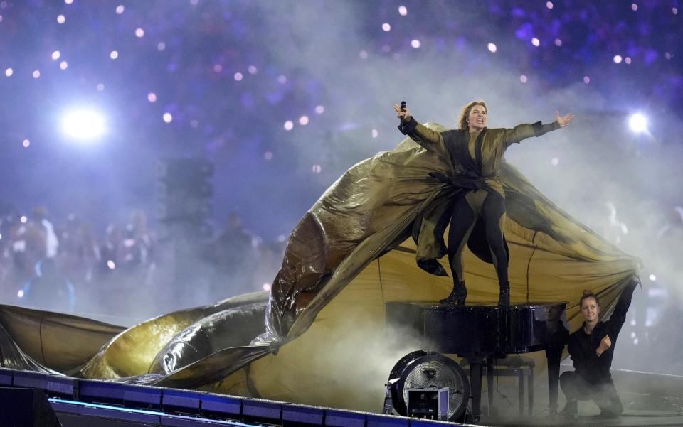 Singer Santa performs during the closing ceremony