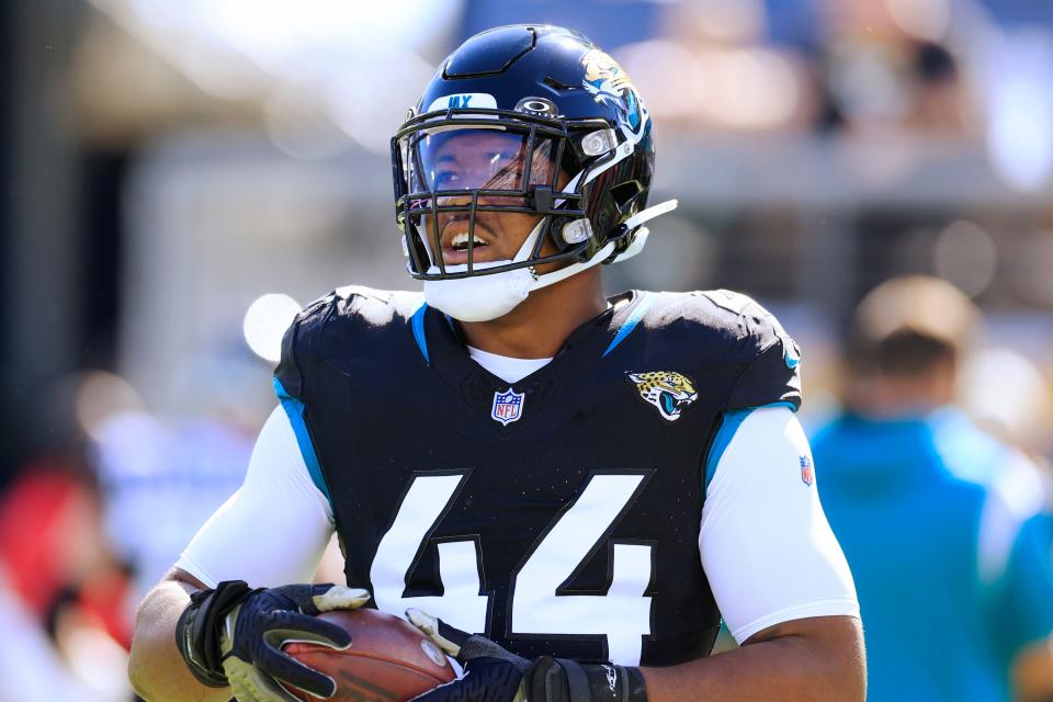 Jacksonville Jaguars linebacker Travon Walker (44) warms up before an NFL football matchup Sunday, Nov. 19, 2023 at EverBank Stadium in Jacksonville, Fla. The Jacksonville Jaguars defeated the Tennessee Titans 34-14. [Corey Perrine/Florida Times-Union]