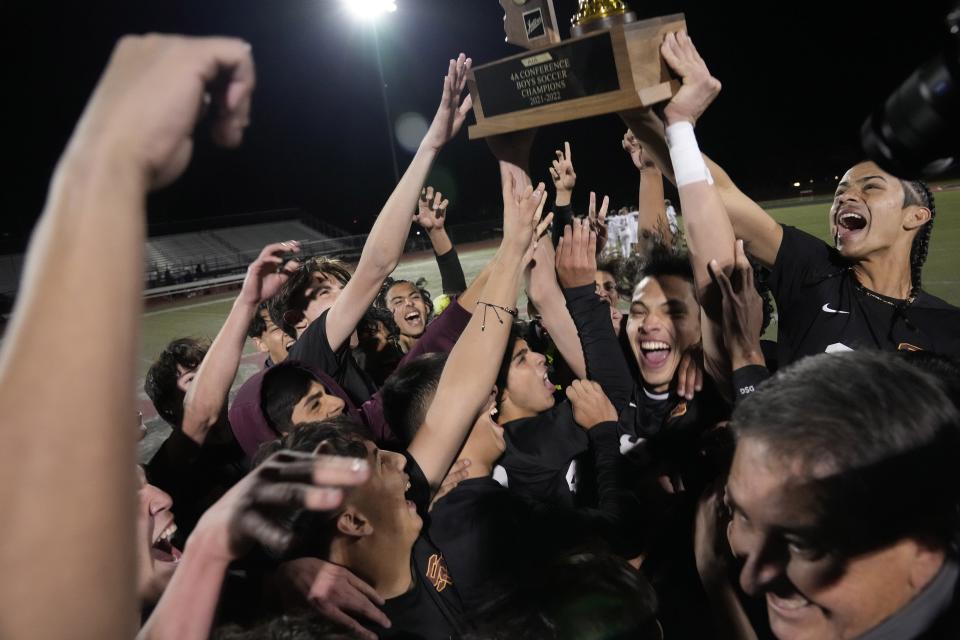 Feb 22, 2022; Gilbert, Arizona, U.S.;  Salpointe Catholic players celebrate their State 4A boys soccer championship against Notre Dame Prep at Williams Field High School.