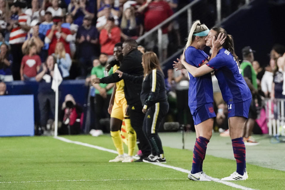 United States' Julie Ertz, left, embraces Andi Sullivan, right, as Sullivan substitutes in for Ertz during the first half of the team's international friendly soccer match against South Africa, Thursday, Sept. 21, 2023, in Cincinnati. (AP Photo/Joshua A. Bickel)