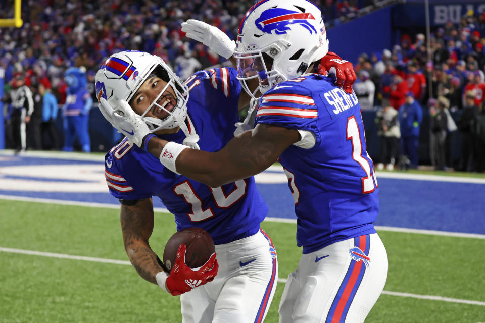 Buffalo Bills wide receiver Khalil Shakir (10) celebrates after his touchdown with Trent Sherfield during the second half of an NFL football game against the New York Jets in Orchard Park, N.Y., Sunday, Nov. 19, 2023. (AP Photo/Jeffrey T. Barnes )