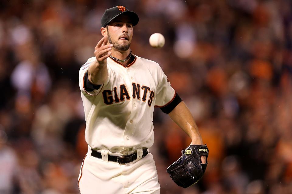 SAN FRANCISCO, CA - OCTOBER 24: George Kontos #70 of the San Francisco Giants flips the base to first to force out Andy Dirks #12 of the Detroit Tigers in the ninth inning during Game One of the Major League Baseball World Series at AT&T Park on October 24, 2012 in San Francisco, California. (Photo by Christian Petersen/Getty Images)