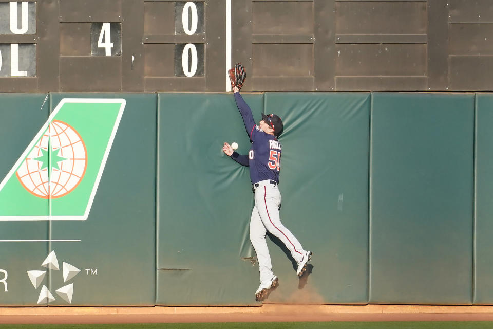 Minnesota Twins right fielder Brent Rooker cannot catch a double hit by Oakland Athletics' Seth Brown during the second inning of the second baseball game of a doubleheader in Oakland, Calif., Tuesday, April 20, 2021. (AP Photo/Jeff Chiu)