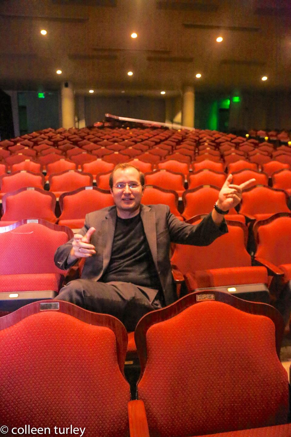 Conductor Radu Paponiu sits at Barbara B. Mann Performing Arts Hall in south Fort Myers