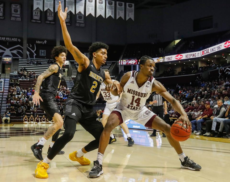 Keaton Hervey, of Missouri State, protects the ball during the Bears game against Alabama State at JQH Arena on Saturday, Nov. 13, 2021.