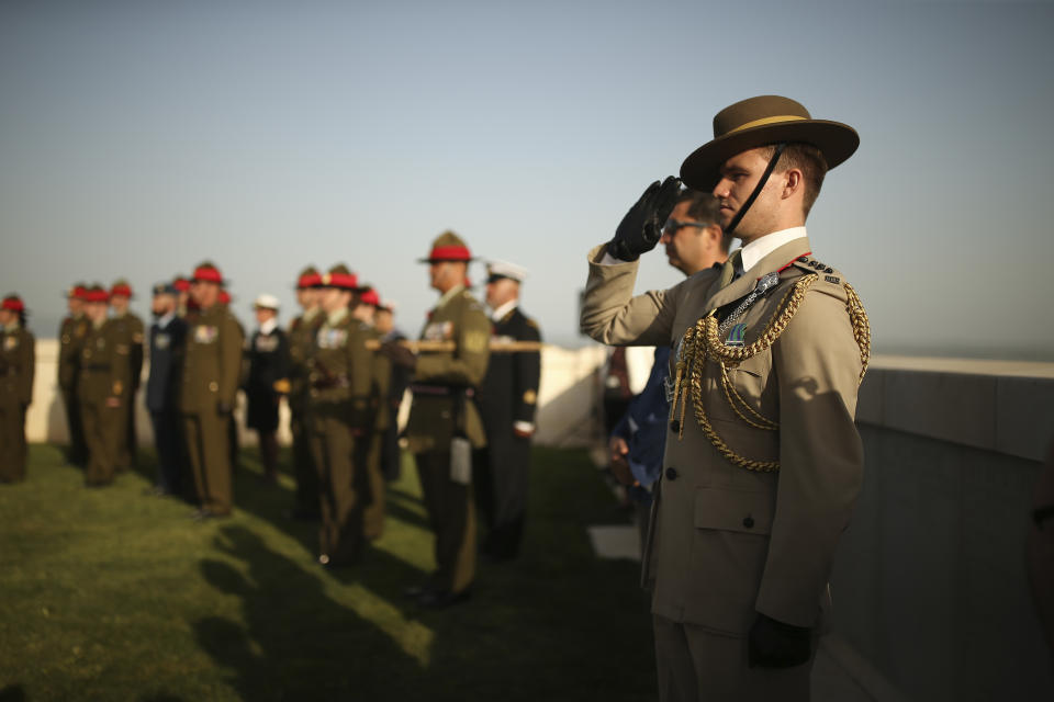 British, Australian and New Zealand soldiers attend a ceremony at the Helles Memorial in the Gallipoli peninsula, Turkey, Sunday, April 24, 2022. The annual Anzac Day ceremony on Monday, April 25 remembers the forces of the Australian and New Zealand Army Corps under British command in World War I who fought a bloody nine-month battle against Turkish forces on the Gallipoli peninsula in 1915. (AP Photo/Emrah Gurel)