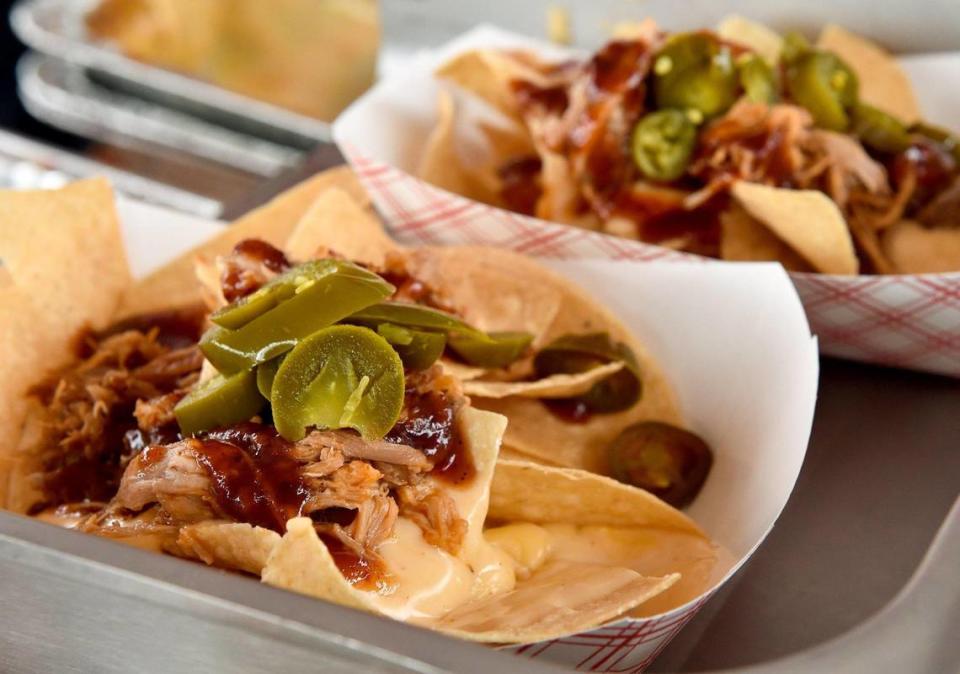 Pulled pork nachos was one of the offerings at the Plowboys Barbeque booth. The three-day Kansas City BBQ Festival in the parking lot of the GEHA Field at Arrowhead Stadium concluded Sunday, July 11, 2021.