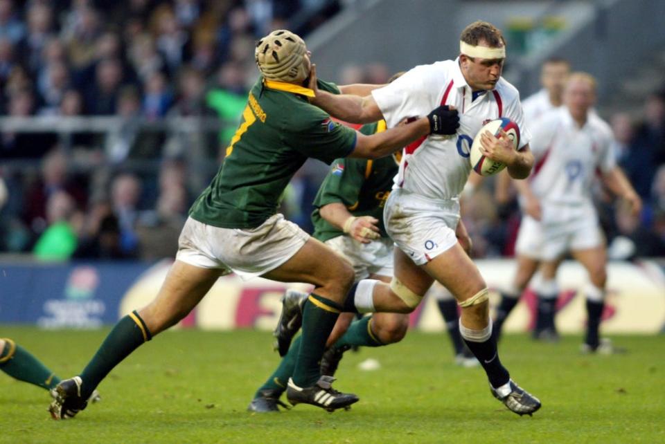 South Africa’s Pedrie Wannenburg (left) tackles England’s Richard Hill (Tom Hevezi/PA) (PA Archive)