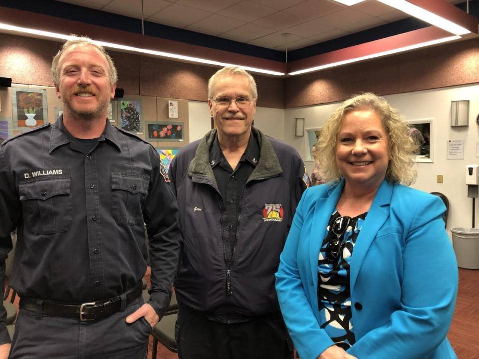 Neshaminy School Board member Cyndie Bowman stands with Feasterville Fire Co. President Dave Williams (left) and Langhorne-Middletown Fire Co. President Steve Link following a Neshaminy School Board meeting Tuesday in which an $800 school district tax refund for volunteers who serve with their fire company or as fire police was enacted.