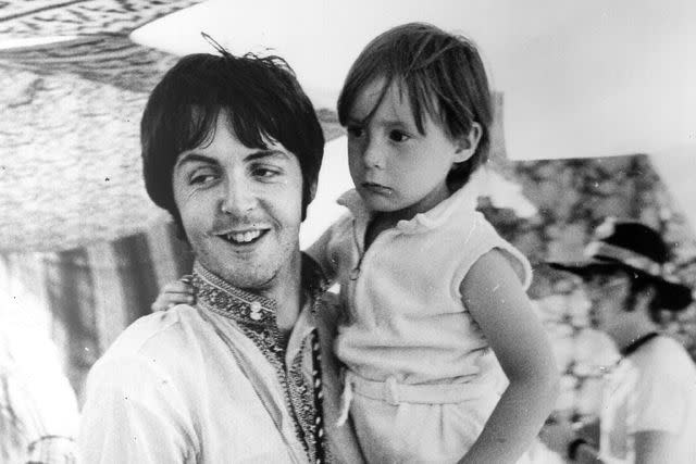 <p>Central Press/Getty</p> Paul McCartney and Julian Lennon during a holiday near Athens in Greece.